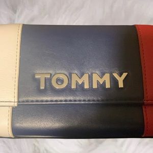 This is a medium size, leather Tommy Hilfiger Wallet.